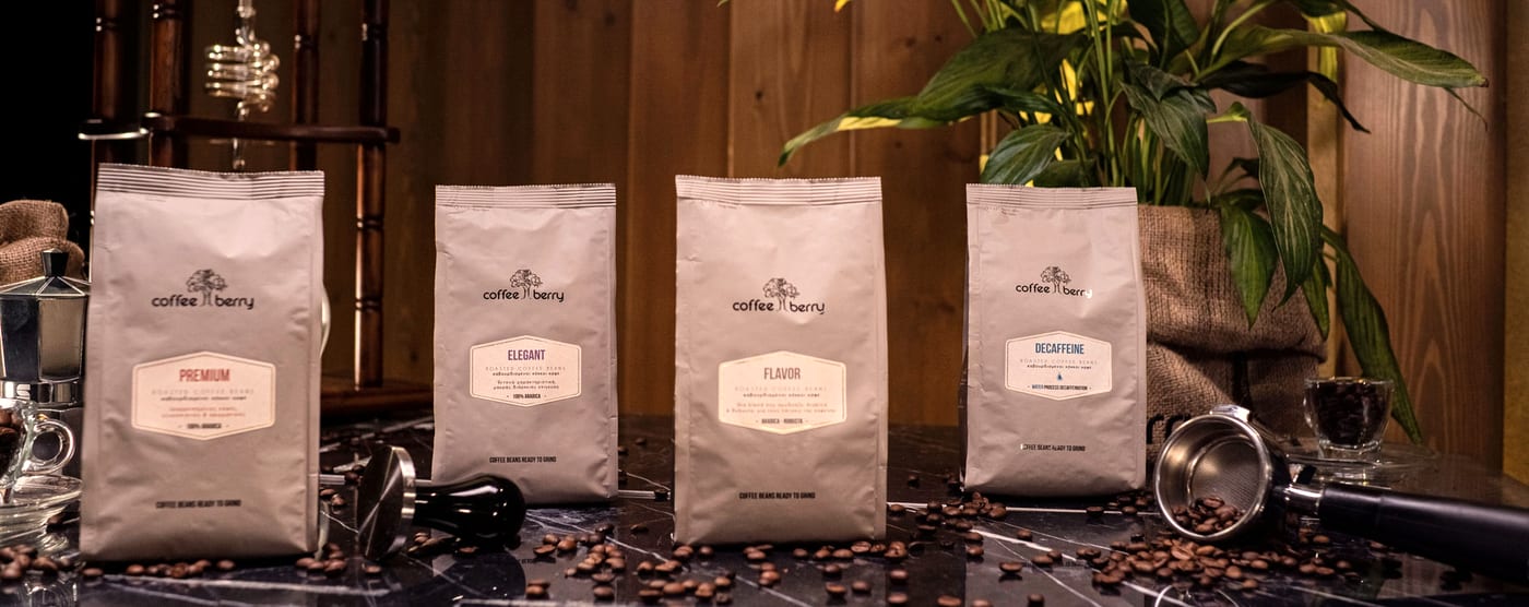 A line-up of Coffee Berry roasted coffee bags on a marble counter
