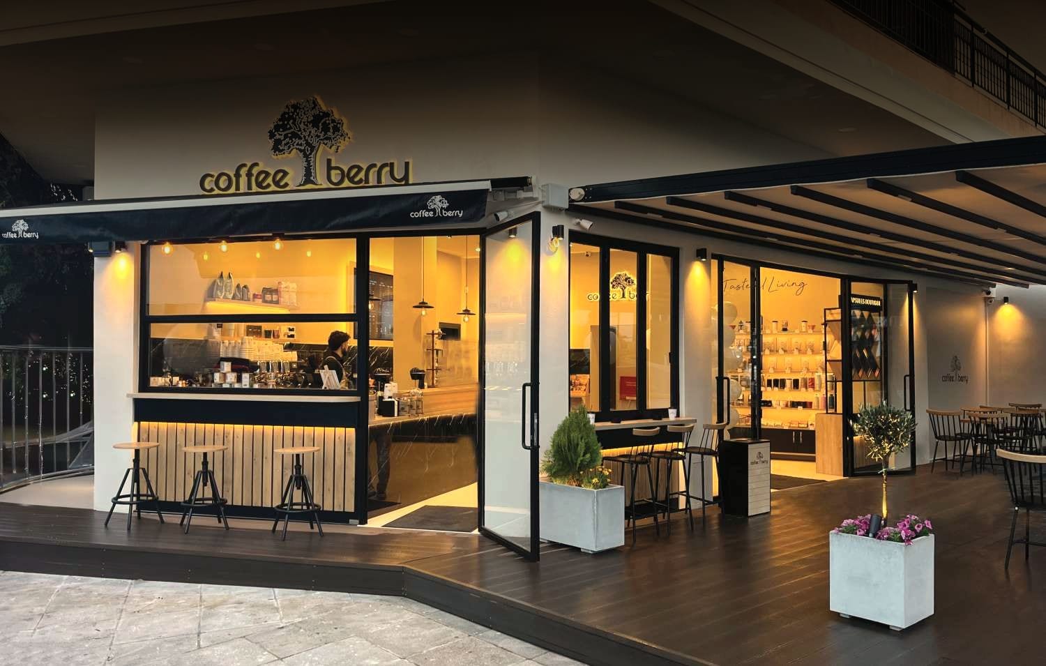 A Coffee Berry store glowing warmly